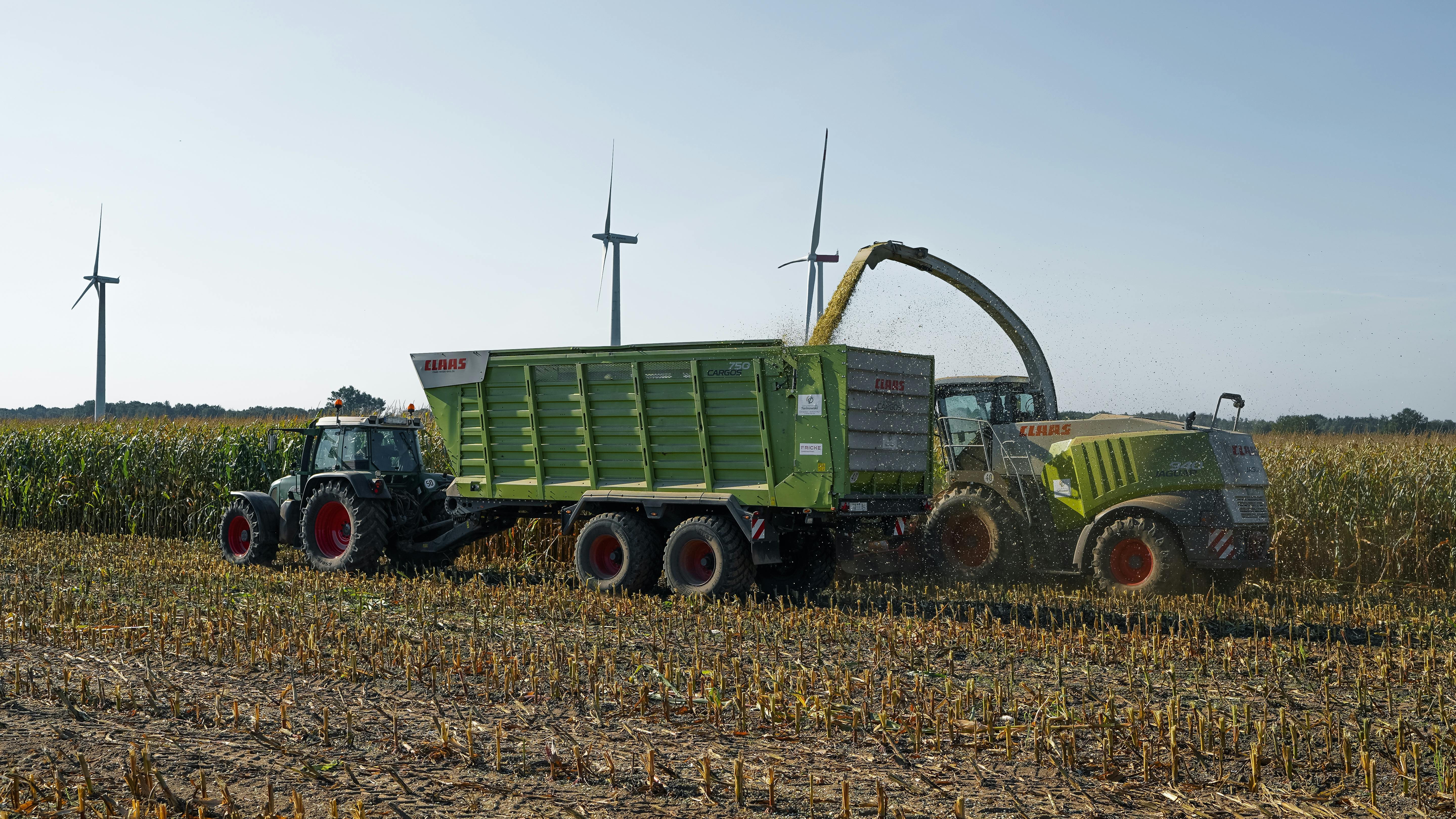 Modern agricultural machinery working in a green field